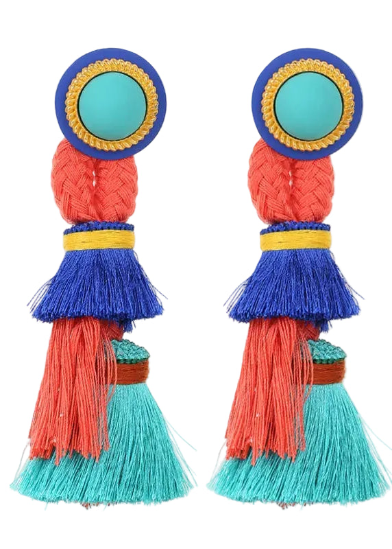 Colorful tassel earrings with blue, red, and green layers on a white background
